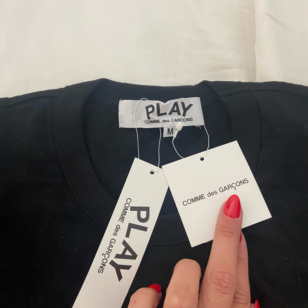 Brand new comme de garçons play shirt. Never worn, tags are still on.